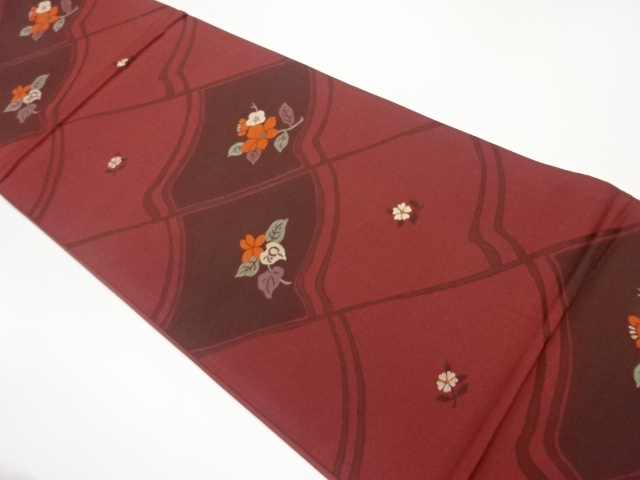 屋根瓦に花葉模様織出し袋帯